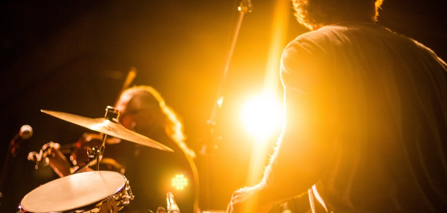 Drummer on stage playing with a band